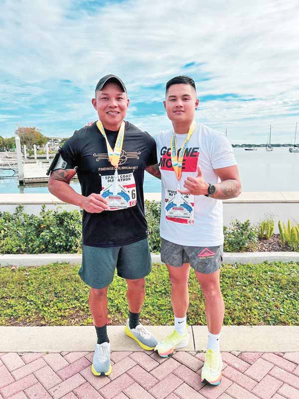 Run Saipan member J.C. Cadua, right, took part in the Florida Space Coast Marathon 2021.