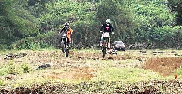 Charles Cepeda, right, and Champi Villacanes in action in last Sunday’s Marianas Racing Association’s Turkey Cross Race