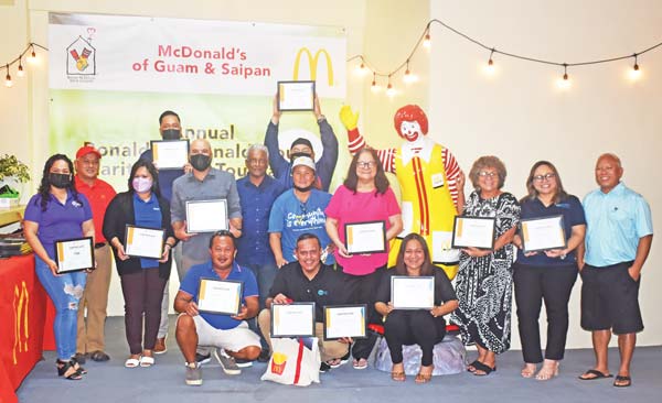 McDonald’s Guam and Saipan owner Jose “Joe” Ayuyu, right, poses with sponsors and members of the Ronald McDonald House of Charities Golf Tournament