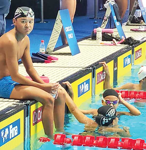 Juhn Tenorio relaxes after setting the CNMI record in the men’s 50m freestyle