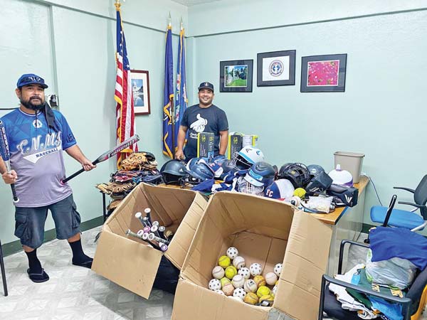 Tinian Amateur Sports Association staff pose with the baseball equipment donated by nonprofit group