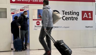 Man with luggage at airport