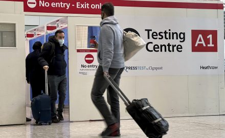 Man with luggage at airport